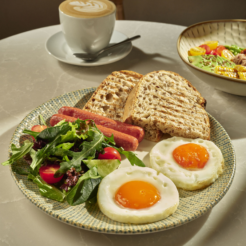 Sunny-side-up eggs with sausages